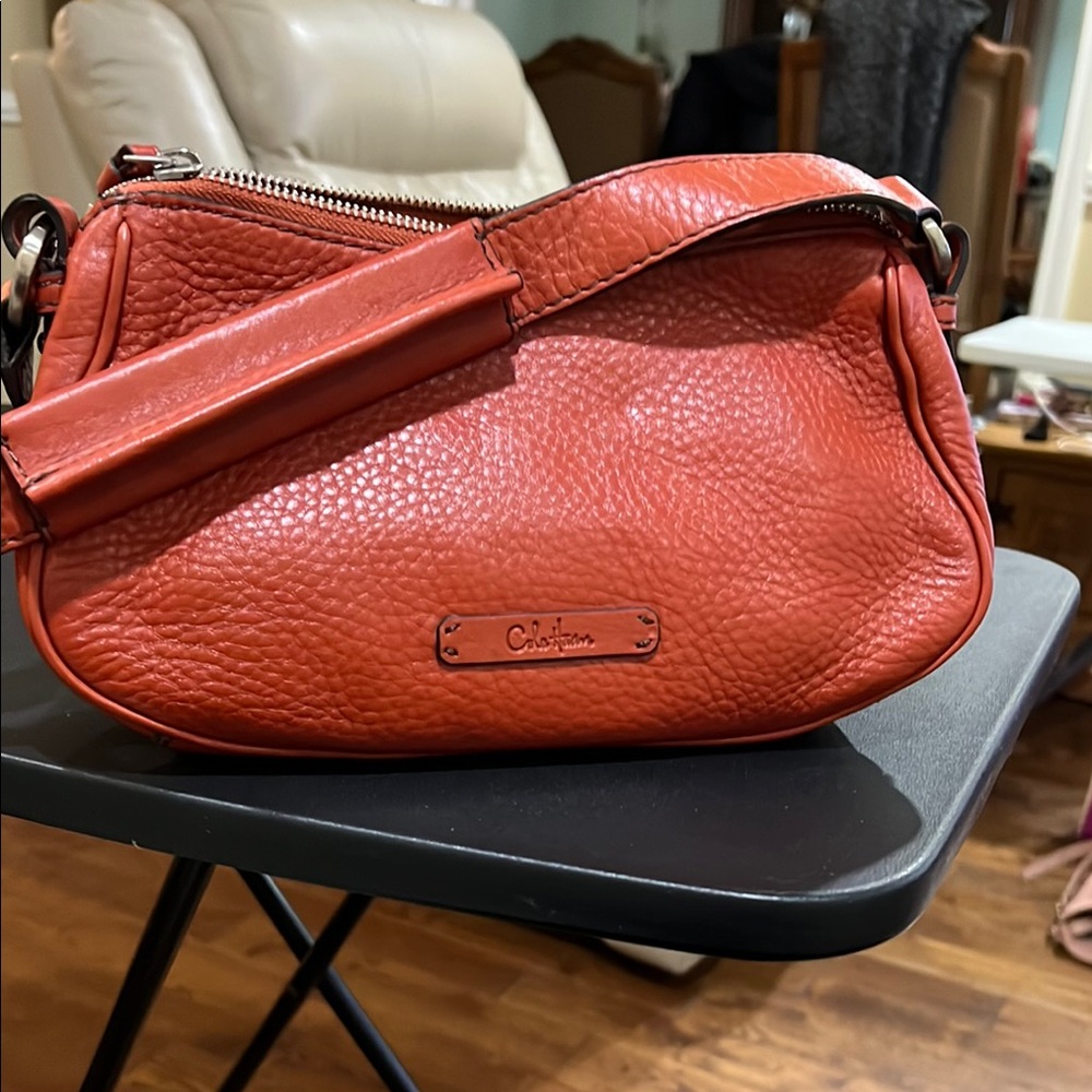 Cole Haan mini orange leather bag in mint condition.